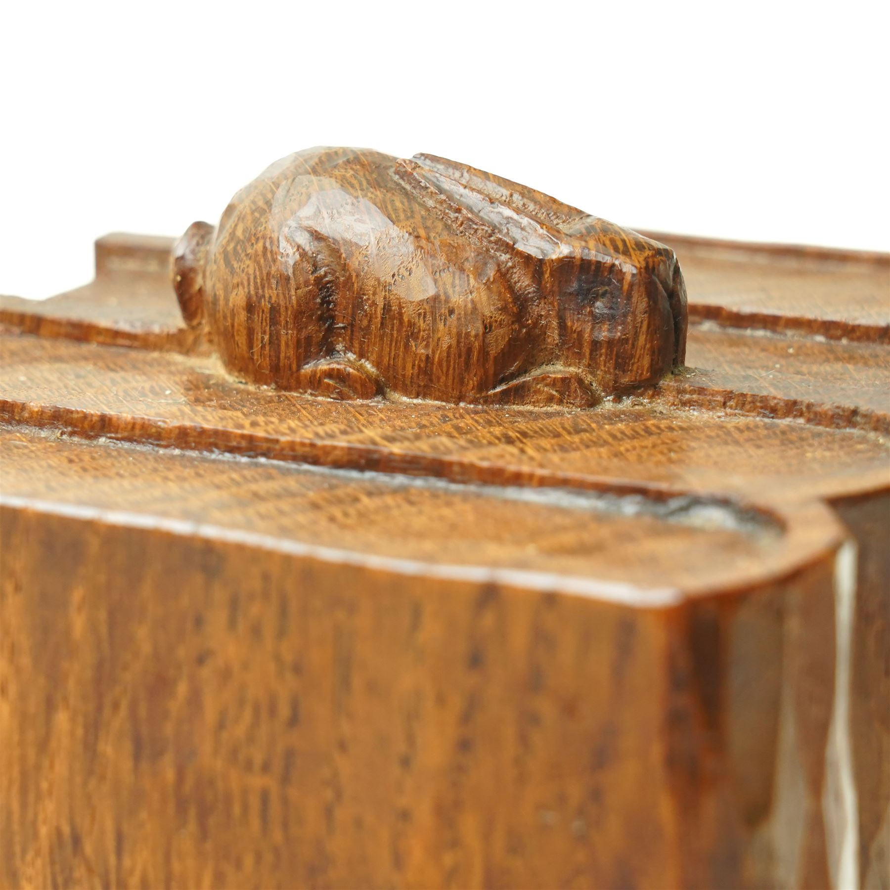 Rabbitman - pair of adzed oak bookends, each carved as a set of four books, with carved rabbit signature, by Peter Heap of Wetwang