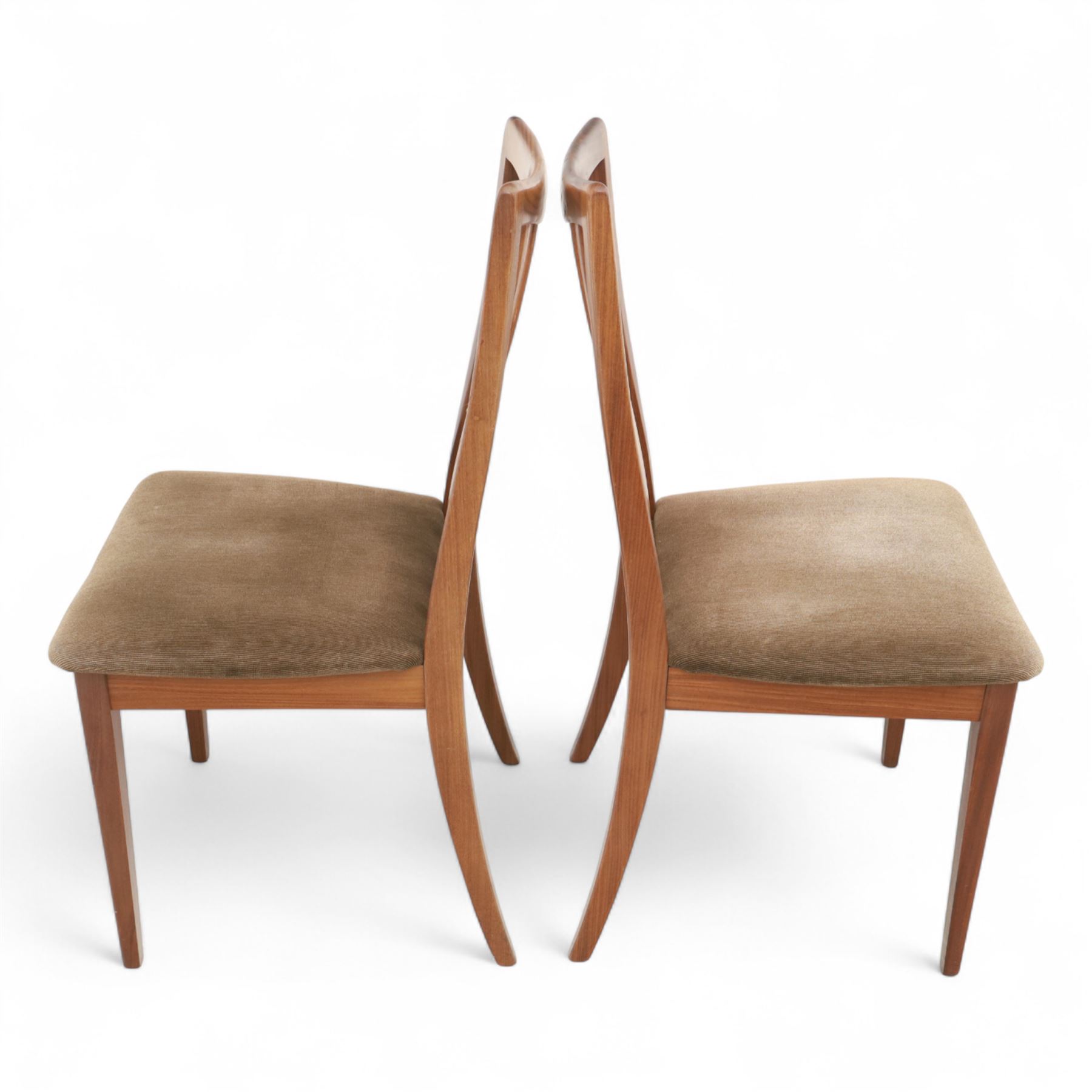 G Plan - mid-20th century teak extending dining table, oval top with integrated extension leaf, raised on tapering legs, together with a set of six slat back dining chairs including two carvers, upholstered in dark green velour (Extends to 210cm)