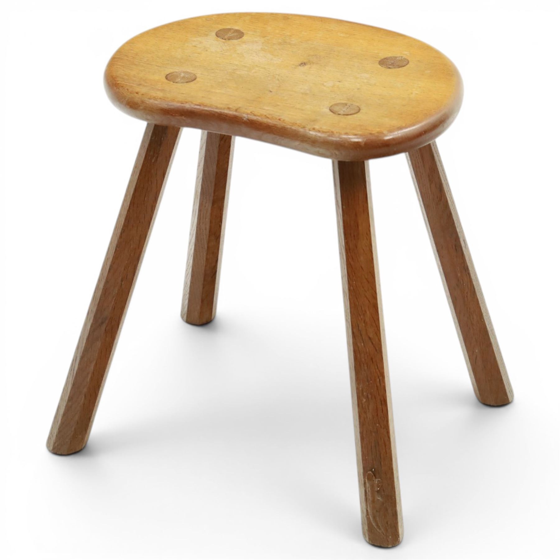 Lizardman - oak milking stool, shaped top with four octagonal supports with carved lizard signature by Derek Slater of Crayke