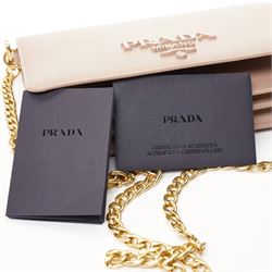 Prada - Saffiano Leather Mini Crossbody Bag, in structured nude-pink leather with detachable gold-tone chain shoulder or crossbody strap and hardware, Prada Milano raised logo, with crimson leather interior, unused with original dust bag
