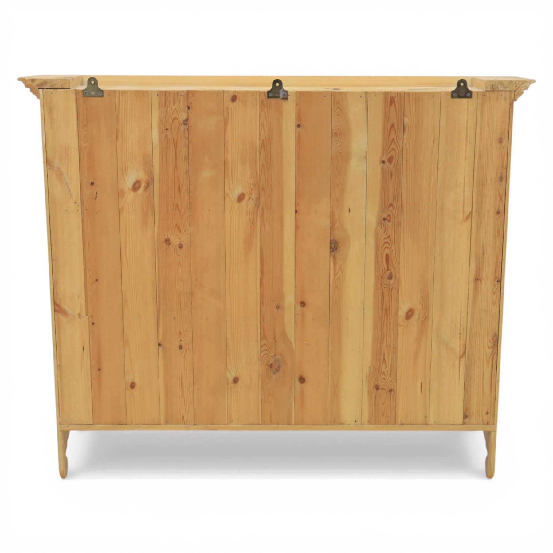 20th century country style waxed pine hanging wall shelf, with projecting cornice, over three fixed delf racks, flanked by applied turned columns, with brass wall hangers