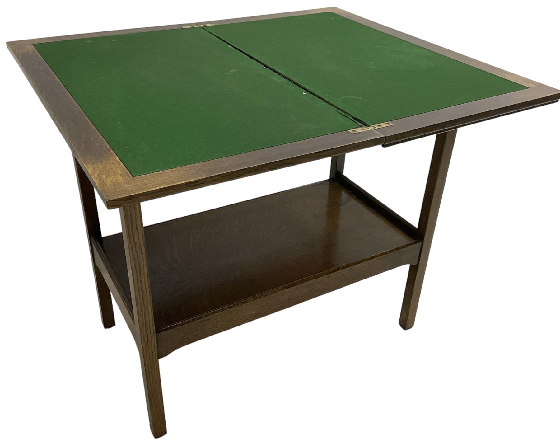 Early 20th century oak card table, fold-over and swivel rectangular top with baize lining, square supports united by undertier 