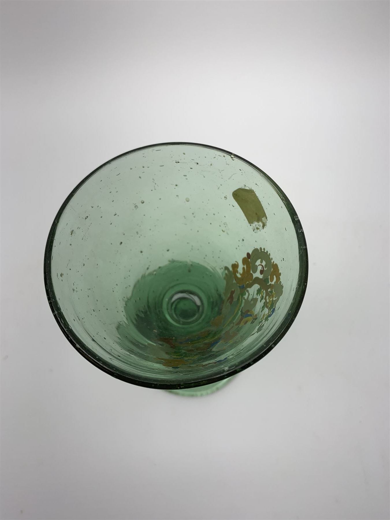 19th century bohemian green glass wine glass, the funnel bowl decorated in enamells with a Historismus hunting scene in the manner of Egermann & Lobmeyr, upon a baluster stem and circular foot, H14.5cm