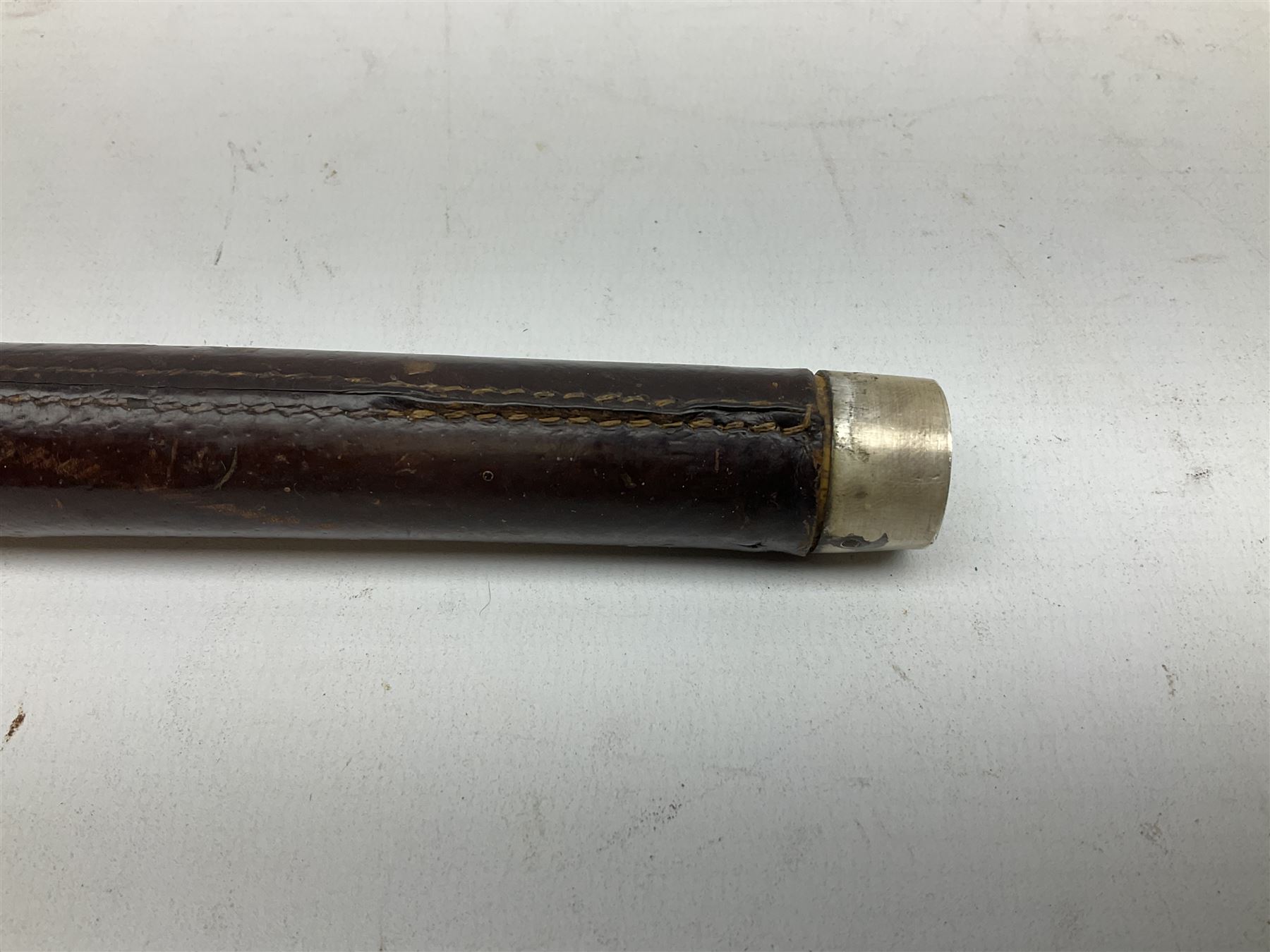 Early 20th century officer's swagger type leather covered sword stick, the 33cm etched single fullered blade marked Wilkinson Pall Mall, with carrying strap L60.5cm