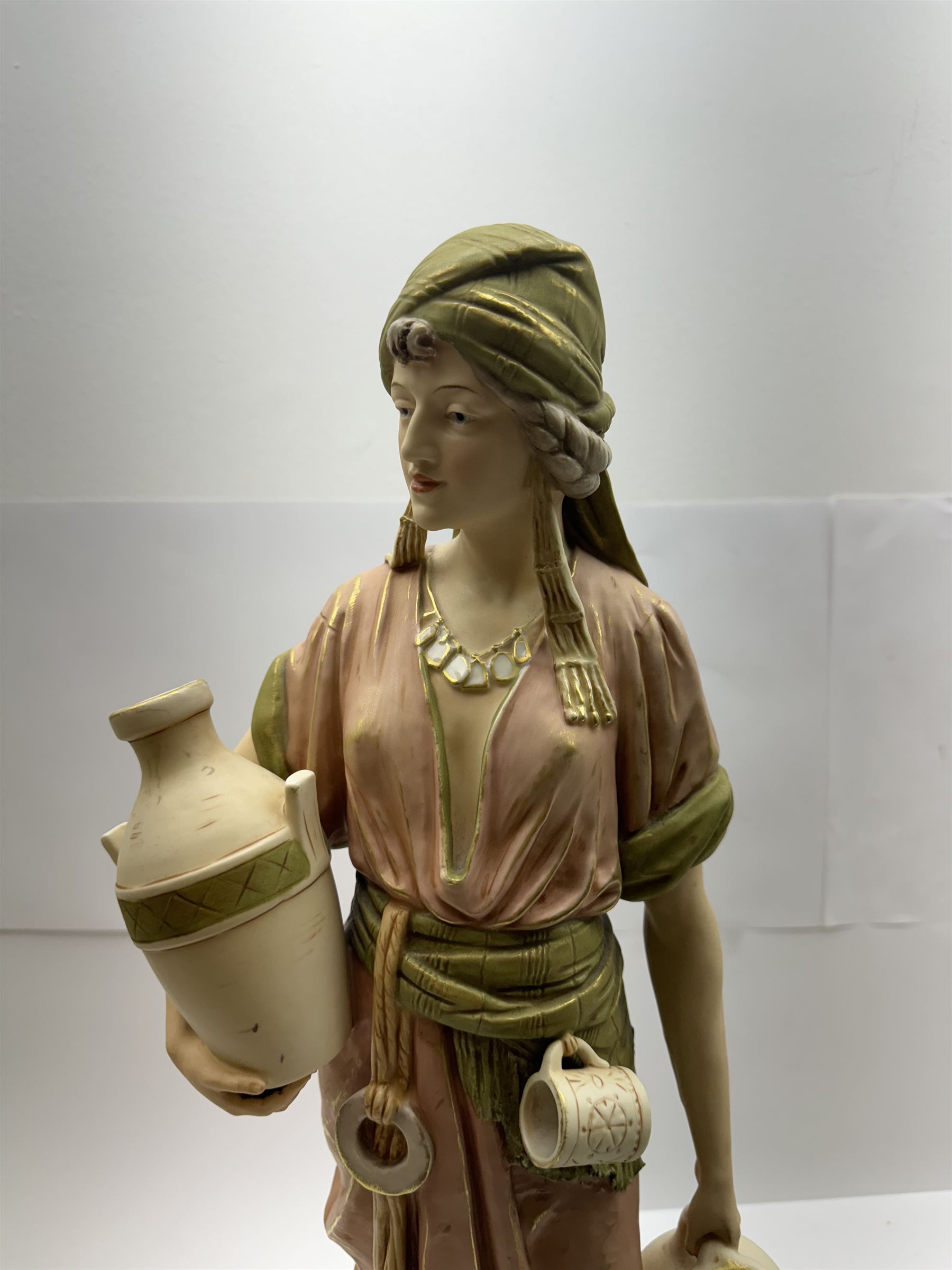 Royal Dux figure no. 686, modelled as a female water carrier, carrying two urns and wearing flowing green and pink robes, with applied pink triangle mark beneath, H61cm
