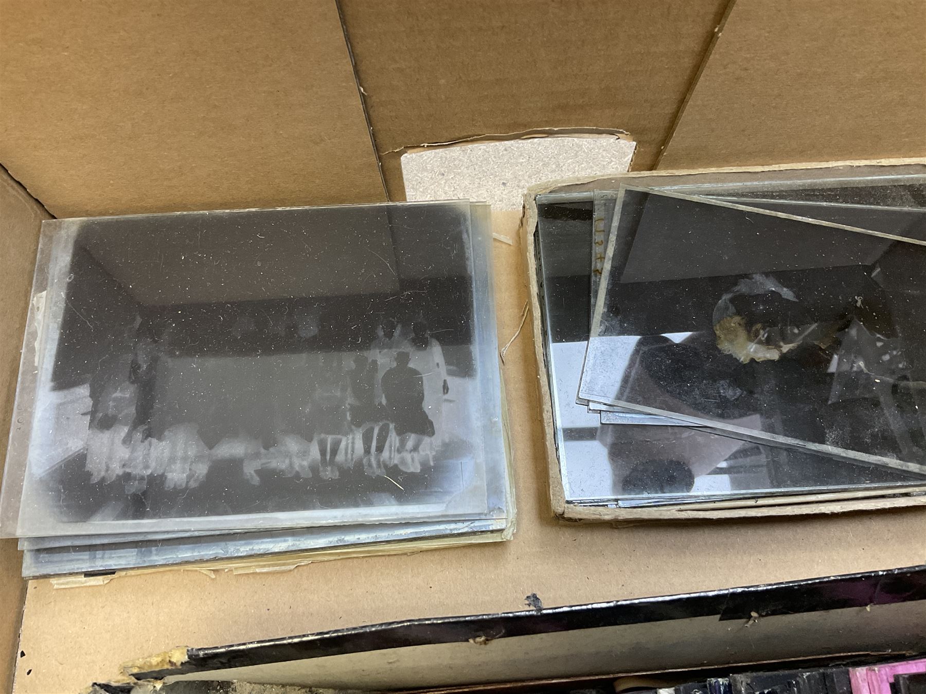 Large collection of over three hundred glass magic lantern slides including country, beach, town and street scenes, some with figures and animals