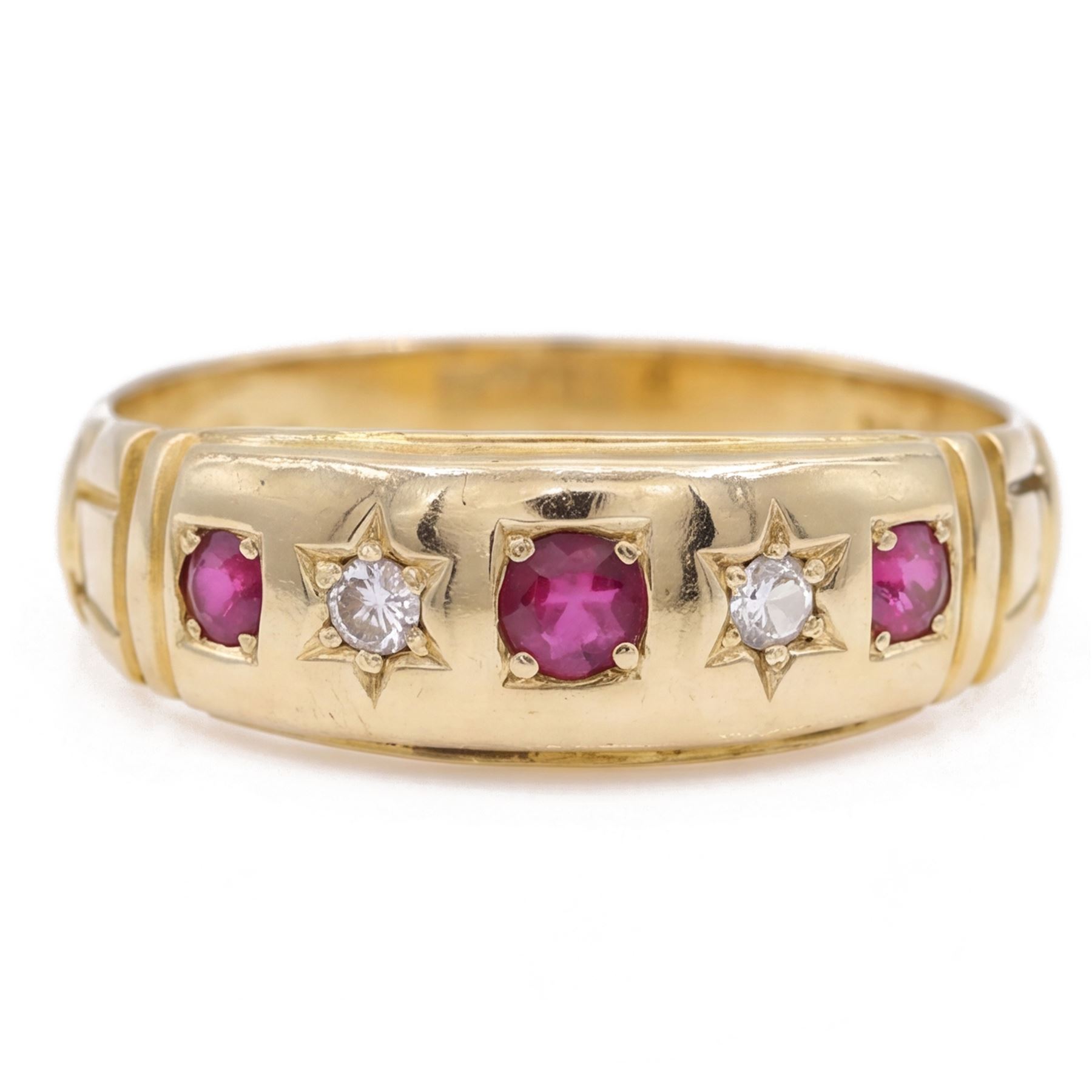 Victorian gold ruby and diamond gypsy ring, three round cut rubies spaced by two star set round cut diamonds, stamped 18ct