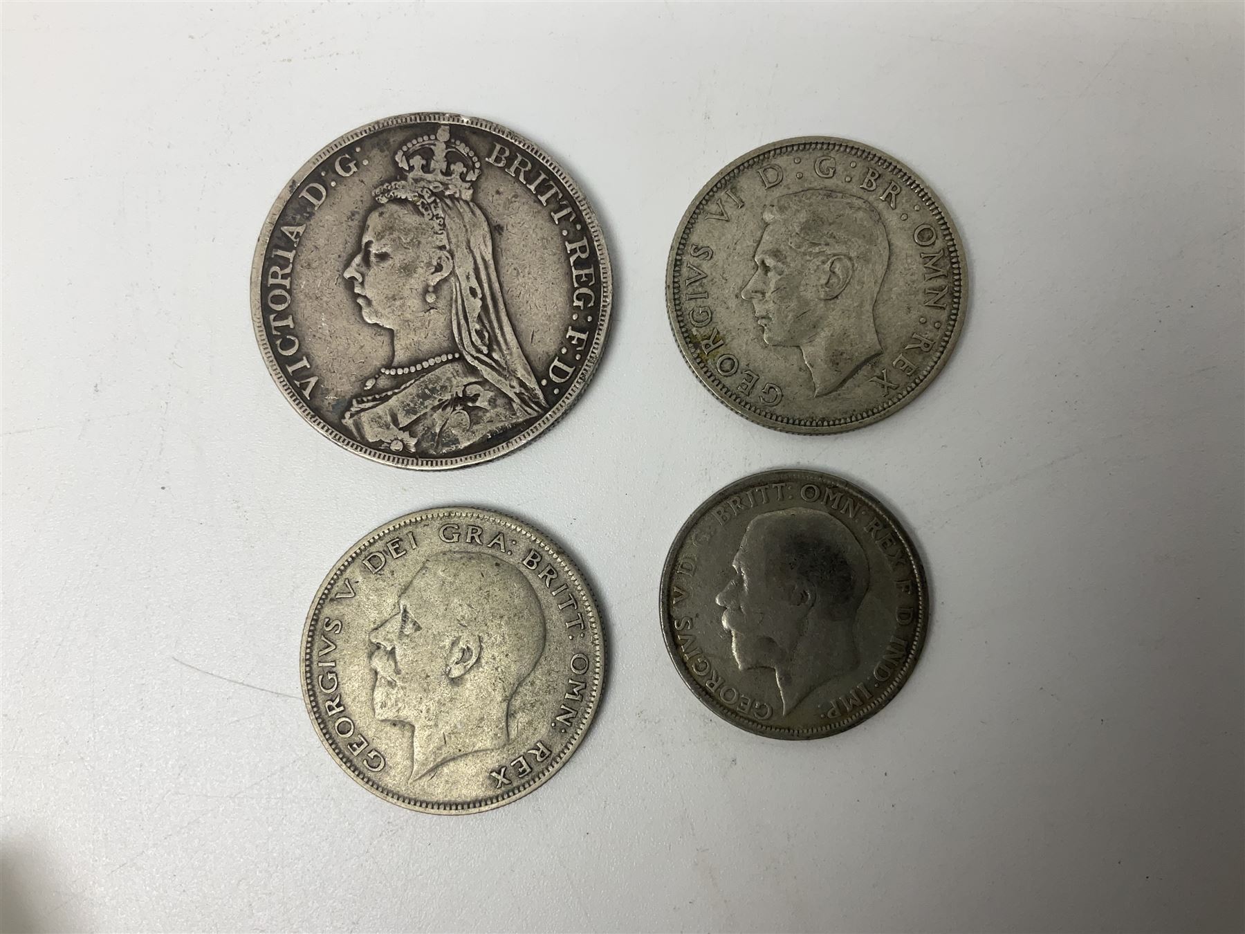 Queen Victoria 1890 crown coin, King George V 1929 half crown, 1922 florin, King George VI 1940 half crown, Bank of England Somerset five pound note 'HW30' and five one pound notes