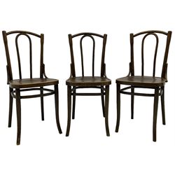 Set of three late 19th to early 20th century century bentwood dining chairs, the seats with pressed anthemion decoration, circa. 1900s