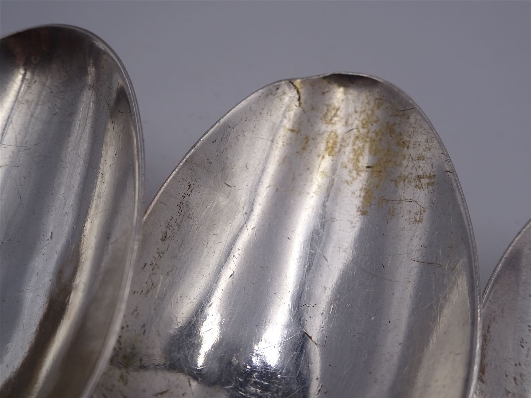 Group of Victorian silver fiddle pattern spoons, comprising pair of sauce ladles and set of six teaspoons, both hallmarked Henry Holland (of Holland, Aldwinckle & Slater), London 1857, set of four table spoons, hallmarked Chawner & Co (George William Adams), London 1857, and set of six dessert spoons, hallmarked Chawner & Co (George William Adams), London 1856, with monogrammed terminals, approximate total silver weight 25.50 ozt (792.6 grams)