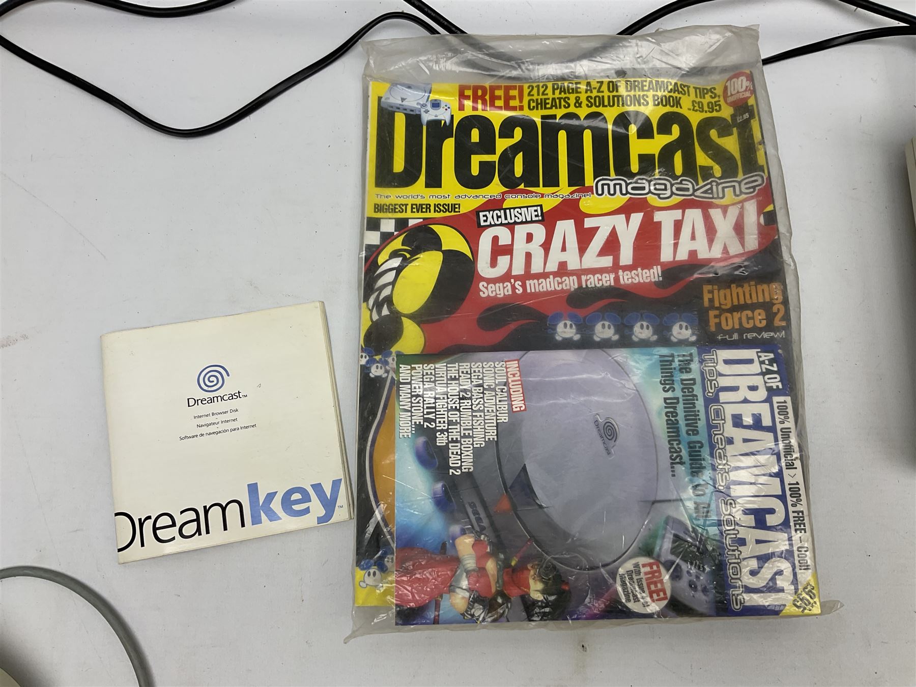 Dreamcast console, one controller, original instruction booklet with magazine and four games, ‘Aerowings’, ‘Buggy Heat’, ‘ Racing Simulation Monaco Grand Prix’ and ‘Who Wants to be a Millionaire’, all in original cases with instruction booklets 