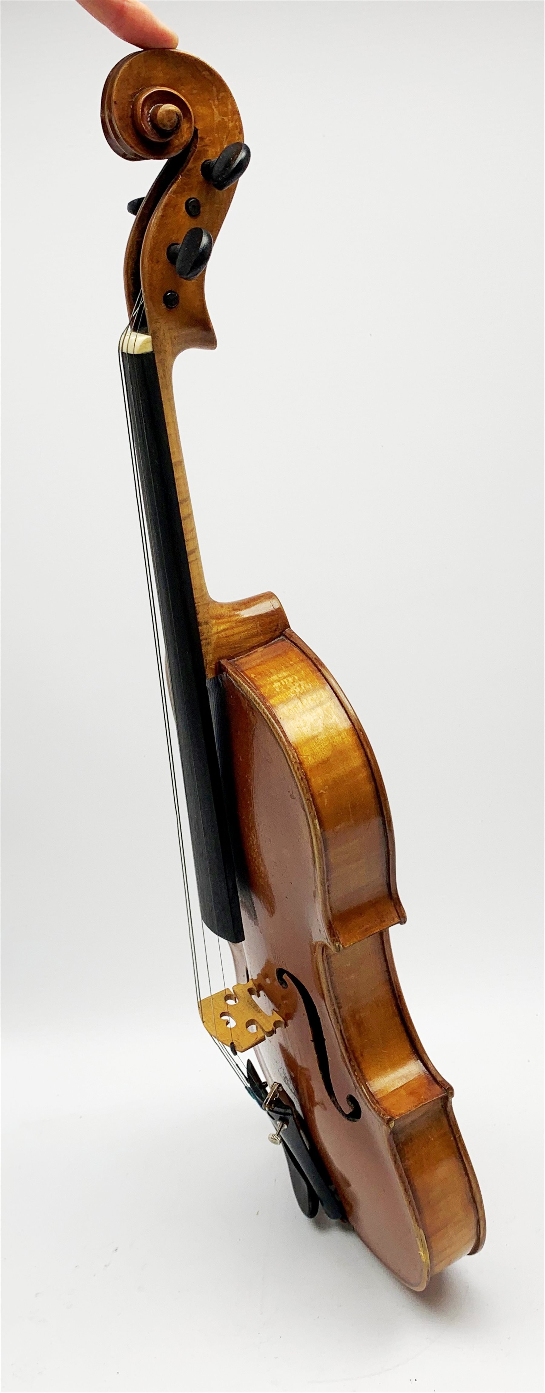  Late 19th century violin with 36cm maple back and spruce top, bears label 'Copy George Klotz Made in 1747', L59cm overall, in ebonised wooden carrying case with two bows  