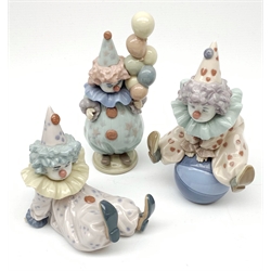 Three Lladro Clown figures: Littlest Clown, no.5811, Tired Friend, no.5812; and Having a Ball, no.5813 (3)