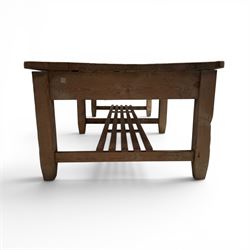 Large early/mid-20th century pine table or work bench, rectangular six plank top on eight tapering supports joined by slatted undertier