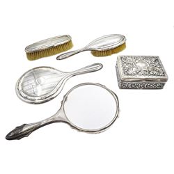 Silver table cigarette/cigar box, embossed floral decoration by William Hutton & Sons Ltd , Birmingham 1900, silver mounted three piece dressing table set by Daniel Manufacturing Company, Birmingham 1928 and a silver mirror hallmarked (5)