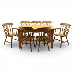 Solid oak dining table and set of seven pine farmhouse chairs including two carvers, recta...