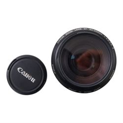 Eight camera lenses, comprising Canon Ultrasonic Zoom EF 75-300mm 1:4-5.6 lens, AF Nikkor 35-70mm 1:3.3-4.5 lens, Nikkor 60-180mm 1:4.5-5.6 lens, Canon Zoom EF 28-80mm 1:3.5-5.6 lens, Canon Zoom EF 80-200mm 1:4.5-5.6 lens, Sigma 70-300mm 1:4.6-5.6 DL Macro, Sigma Zoom 70-210mm 1:4-5.6 UCII lens and a Sigma AF 70-300mm 1:4-5.6 APO Macro lens, all with lens caps