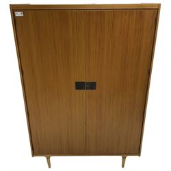 Wrighton - mid-20th century teak wardrobe, two doors enclosing hanging rail, shelves and hinged compartments, on turned tapering feet
