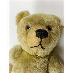 Chad Valley large teddy bear c1930s with wood wool filled blond mohair body, jointed swivel head with glass eyes, shaved muzzle with vertically stitched nose and mouth and jointed limbs H21