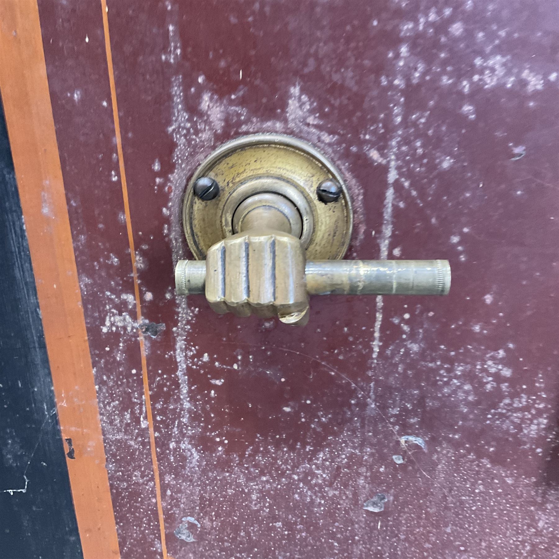 Samuel Withers & Co of West Bromwich - Victorian cast iron safe, the brass handle modelled as a clenched fist, painted in red, orange and black, with key. Ground floor delivery only, no steps.