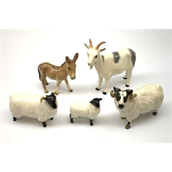 A Beswick Billy Goat, together with a Beswick Donkey, and Beswick Ram, Ewe, and Lamb, each with printed mark beneath. 