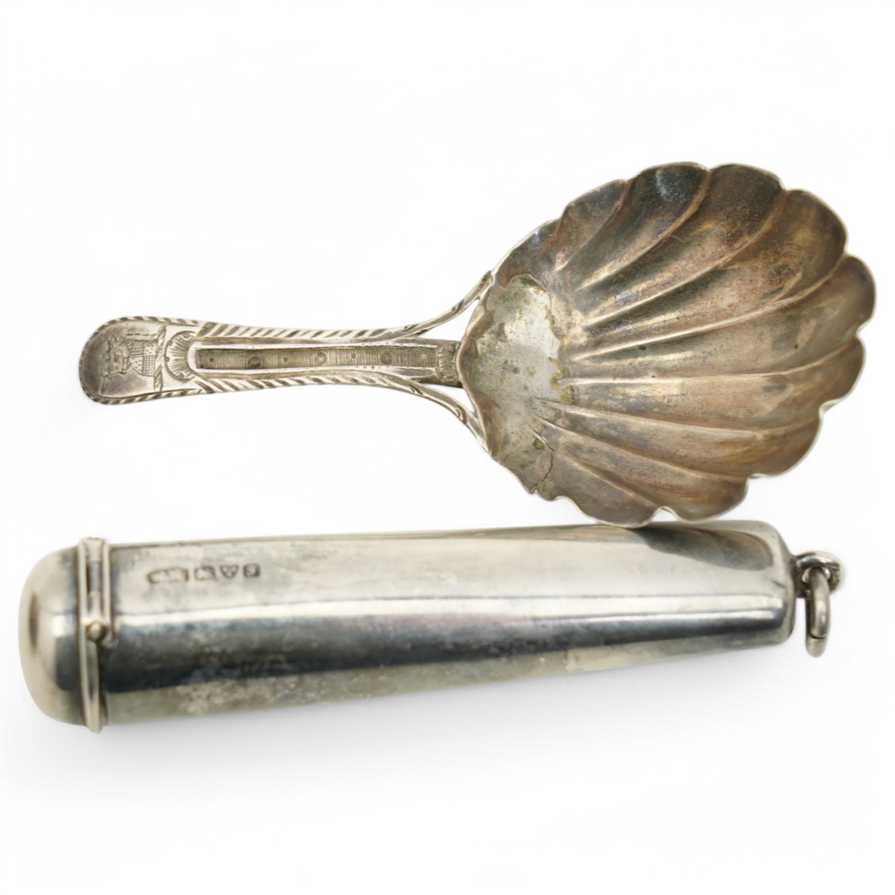 Early 19th century silver mounted cowrie shell snuff box with engraved decoration, George IV silver caddy spoon and a silver cheroot holder