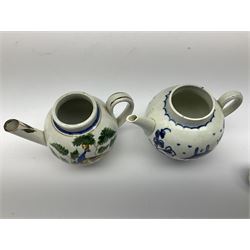 Two 18th century miniature or toy pearlware teapots, the first example lacking cover decorated with an exotic bird, the second with cover painted in underglaze blue with hut and fence, second example approximately H8cm