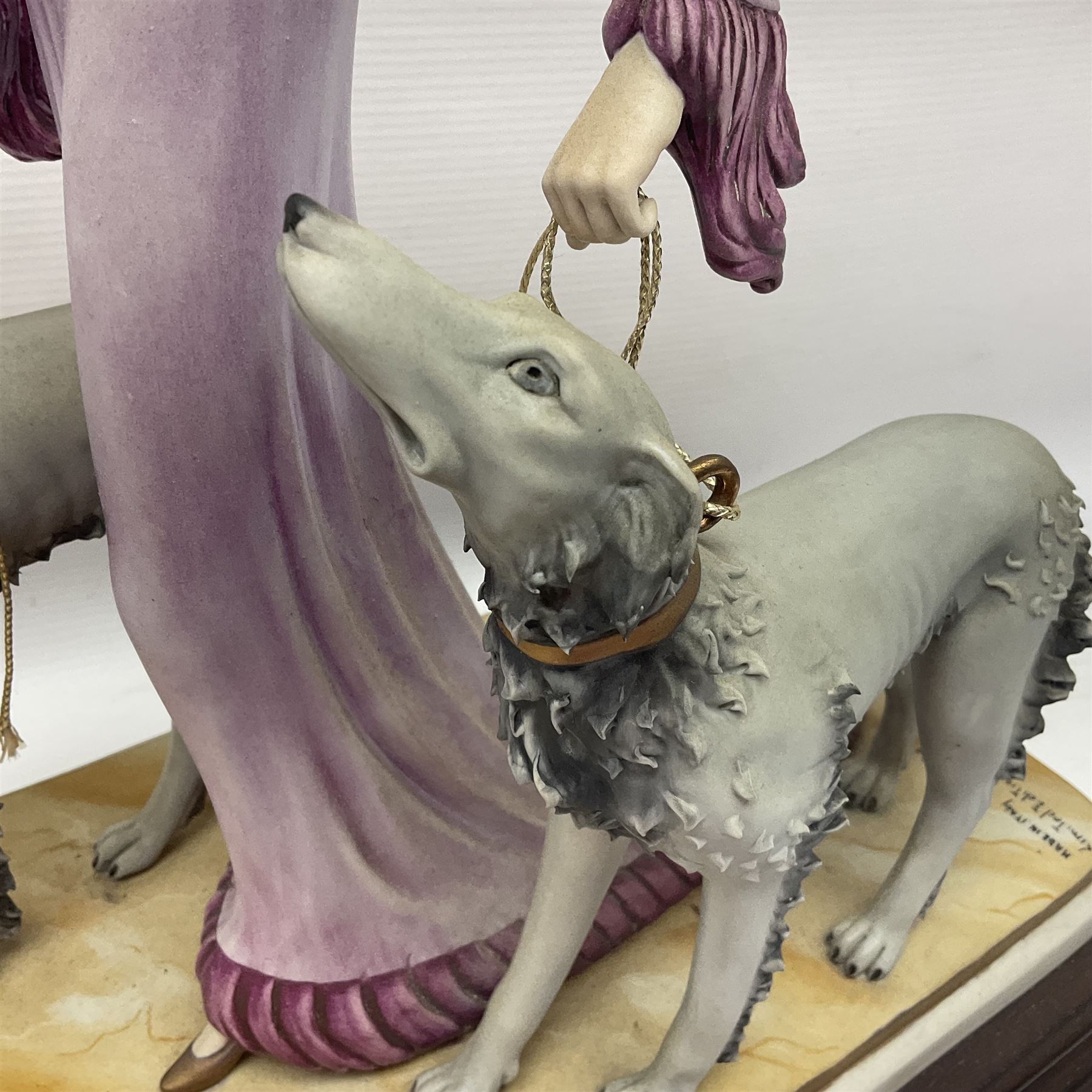 Capodimonte figure Ester, modelled of a lady with two dogs, upon a stepped wooden base, H45cm
