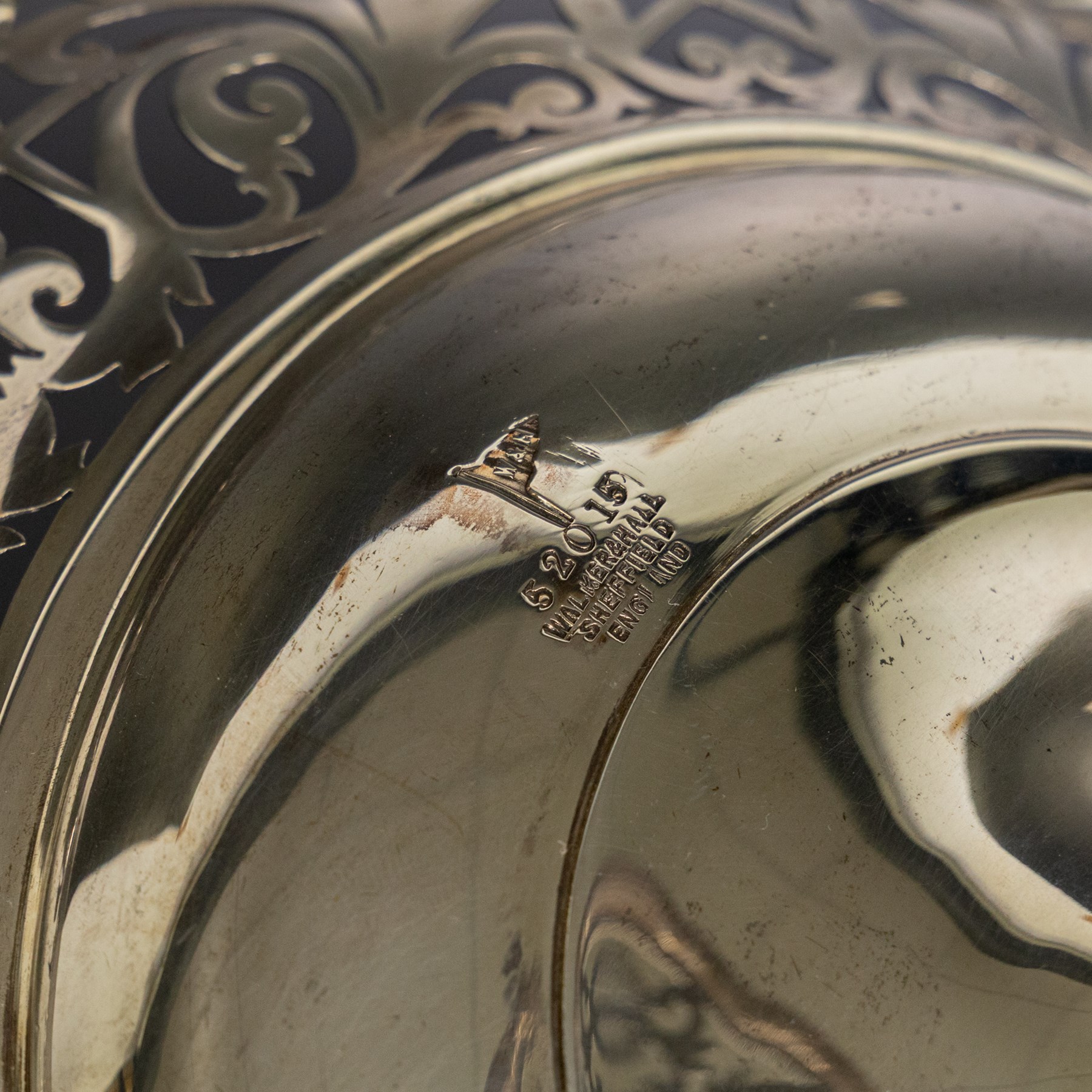 Early 20th century silver twin handled tazza, the bowl of circular form with pierced foliate decoration and ribbon and reed border, with two whiplash curved handles, upon a knopped stem and pieced foliate foot, hallmarked Walker & Hall, Sheffield 1911, H20cm