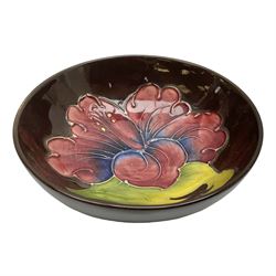 Small Moorcroft pin dish, decorated in the Hibiscus pattern with brown ground, D11cm