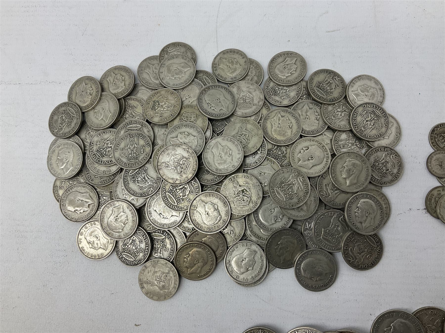Approximately 1800 grams of Great British pre 1947 silver coins, including halfcrowns, florins, shillings etc