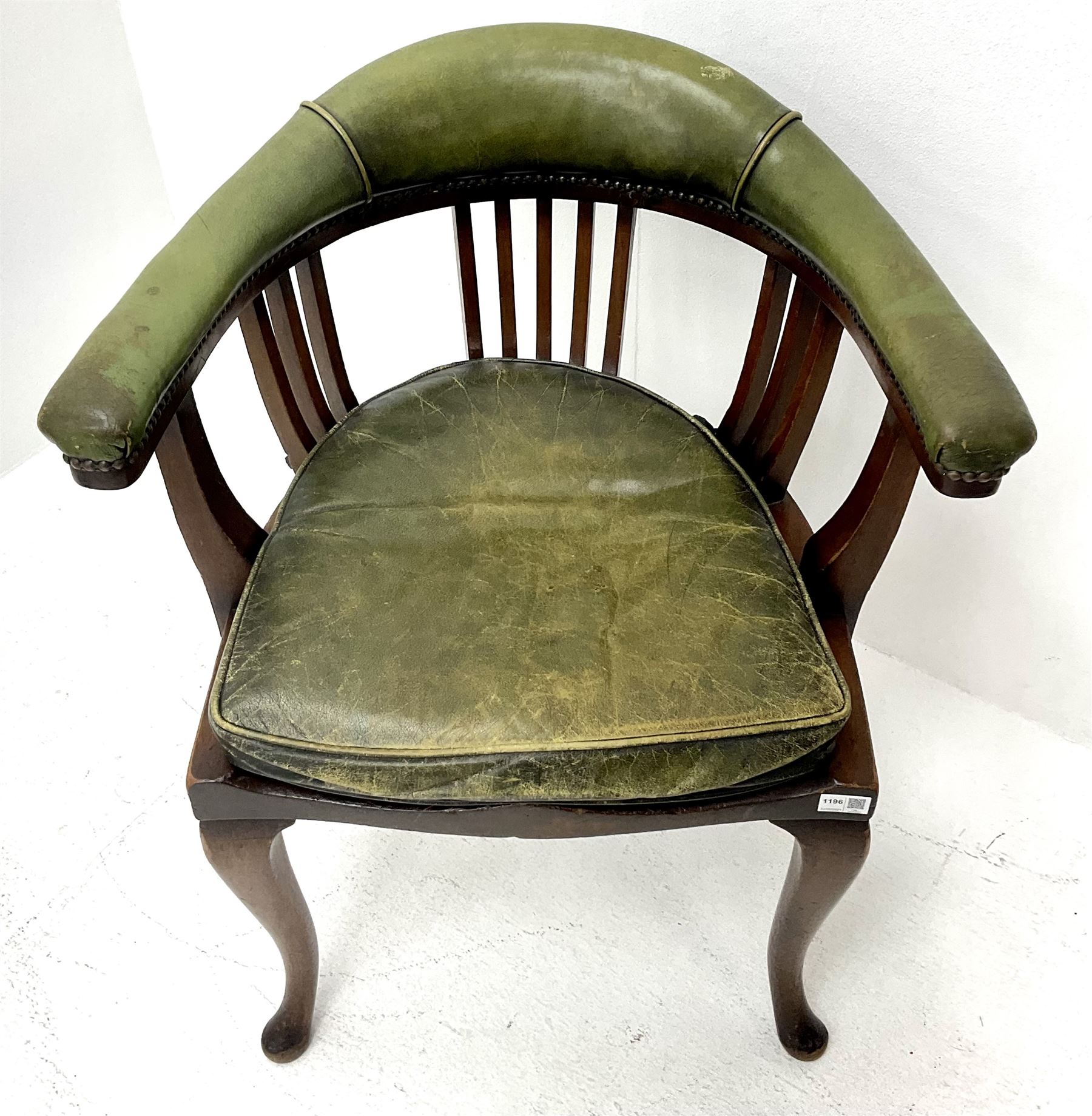 Early 20th century desk chair, shaped arm rail upholstered in studded