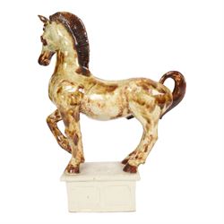 Owen Thorpe, studio pottery horse, standing with one leg raised, upon a rectangular plinth, H35cm 