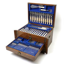Suite of plated table cutlery for twelve covers including fish cutlery and servers, fruit knives and forks with mother of pearl handles, bone handled knives, carvers etc in an oak  three drawer cabinet with hinged lid W47cm 160 pieces