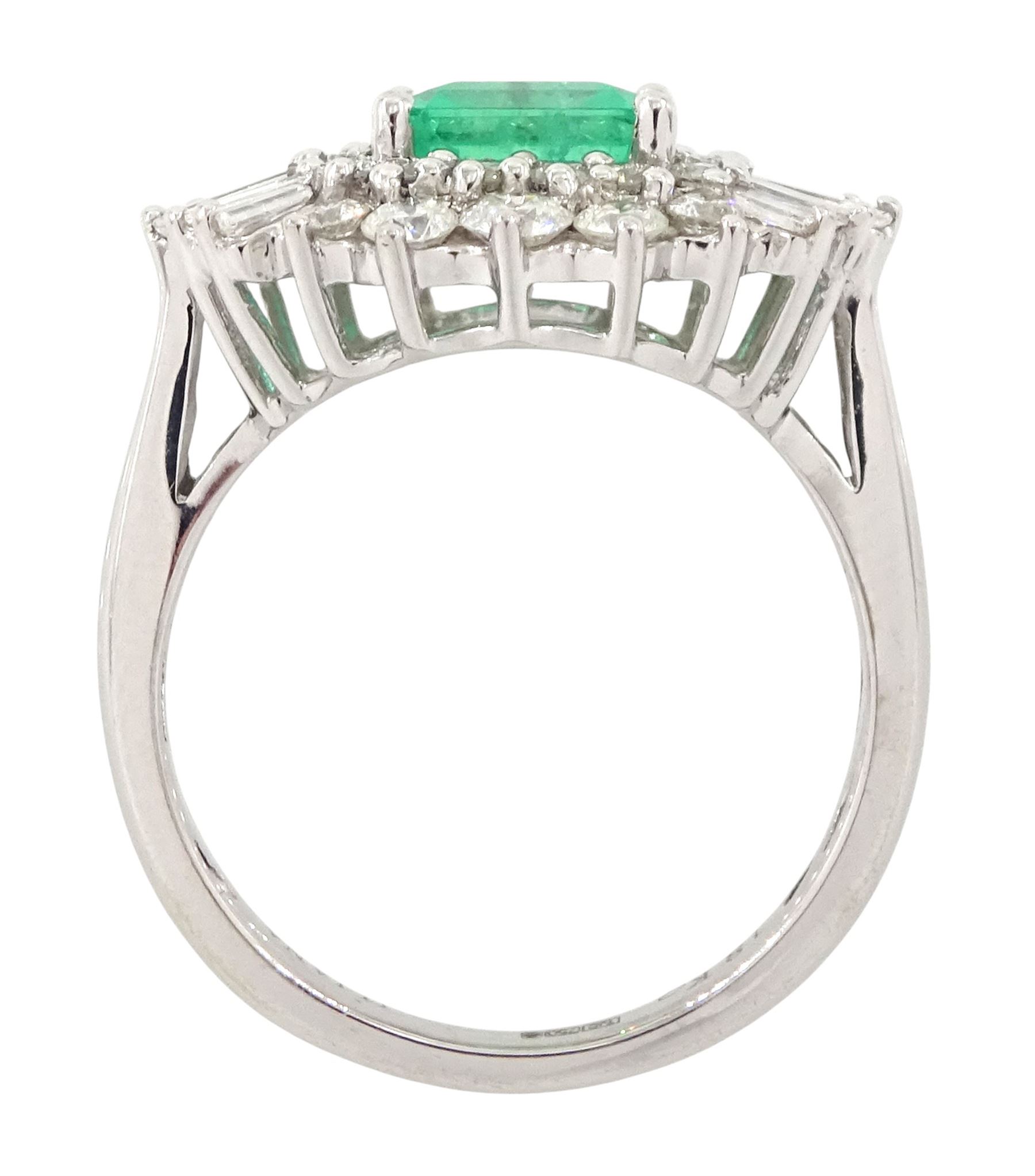18ct white gold Colombian emerald and diamond cluster ring by Iliana, single octagonal cut emerald of 1.65 carat, surrounded by two rows of round brilliant cut and tapered baguette cut diamonds, hallmarked