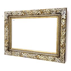 Rectangular wall mirror in leaf moulded frame, bevelled plate