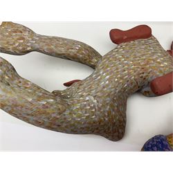 Helen Skelton (British 1933 – 2023): Two carved wooden abstract sculptures, one modelled as a dog, the other modelled as a bear, both with painted stippled decoration, largest H20cm. Born into an RAF family in 1933 in Kent and travelled the world extensively during her childhood. After settling in Bridlington, Helen immersed herself in painting, textiles, and wood sculpture, often inspired by nature's beauty. Her talent was showcased in a one-woman show at Sewerby Hall and recognised with the sculpture prize at Ferens Art Gallery in 2000. Sadly, Helen’s daughter passed away from cancer in 2005. This loss inspired Helen to donate her sculptures to Marie Curie upon her passing in 2023.