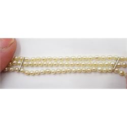 Three strand pearl necklace, with platinum diamond milgrain clasp and a single strand graduating pearl necklace with 18ct white gold clasp set with a diamond