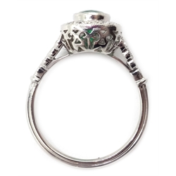  Platinum (tested) oval emerald and diamond ring, with diamond set shoulders  