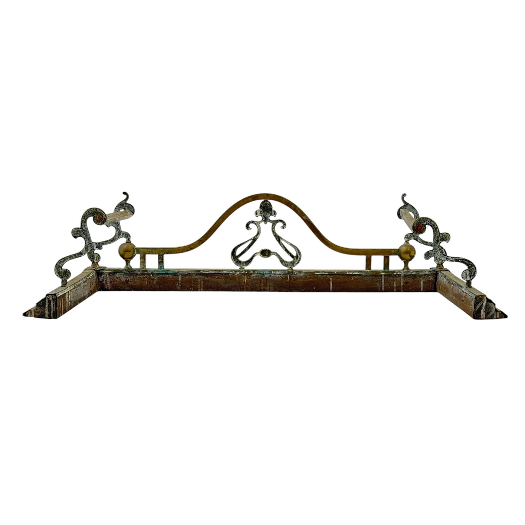 Three 20th century brass fenders, two with pierced Art & Crafts design rails, largest W156cm, D 45cm 