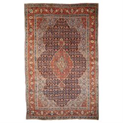 Persian indigo ground Herati rug, the busy field with a central lozenge pole medallion sur...