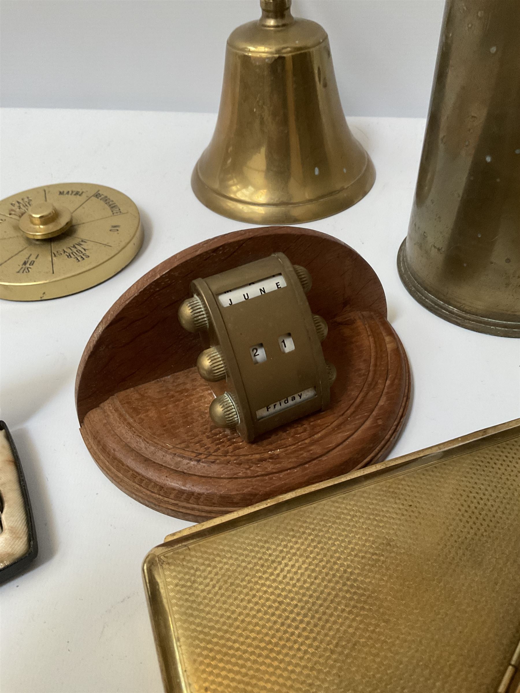 Quantity of brass to include Canadian 18 Pr. Mark II brass shell case,  Corinthian column candlestick with weighted base, perpetual desk calendar on wood base, engine turned cigarette cases and a quantity of metal table lighters etc