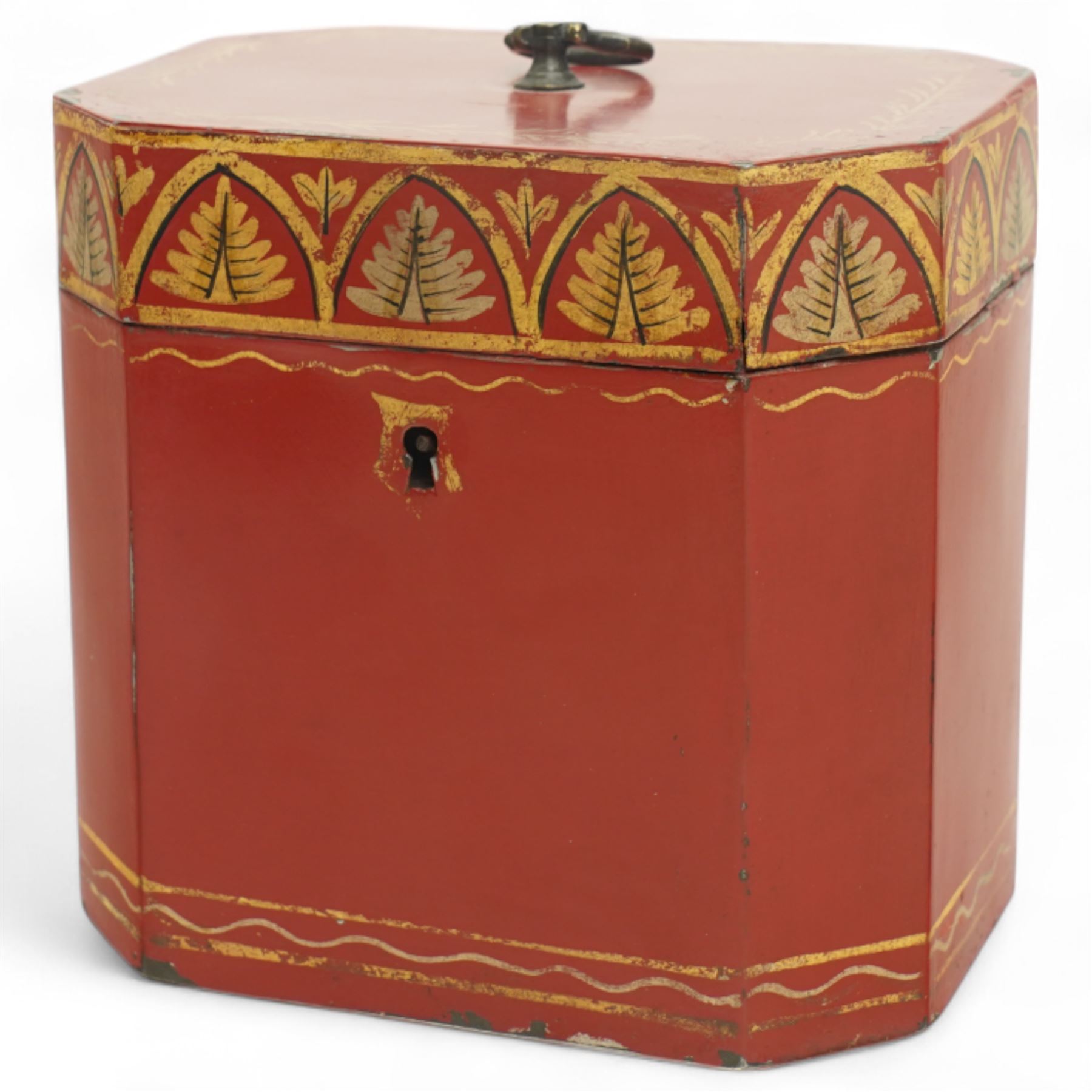 Regency period rare red toleware tea caddy of octagonal from, the cover decorated with a repeating pattern of gilt leaves, with key, H11cm 