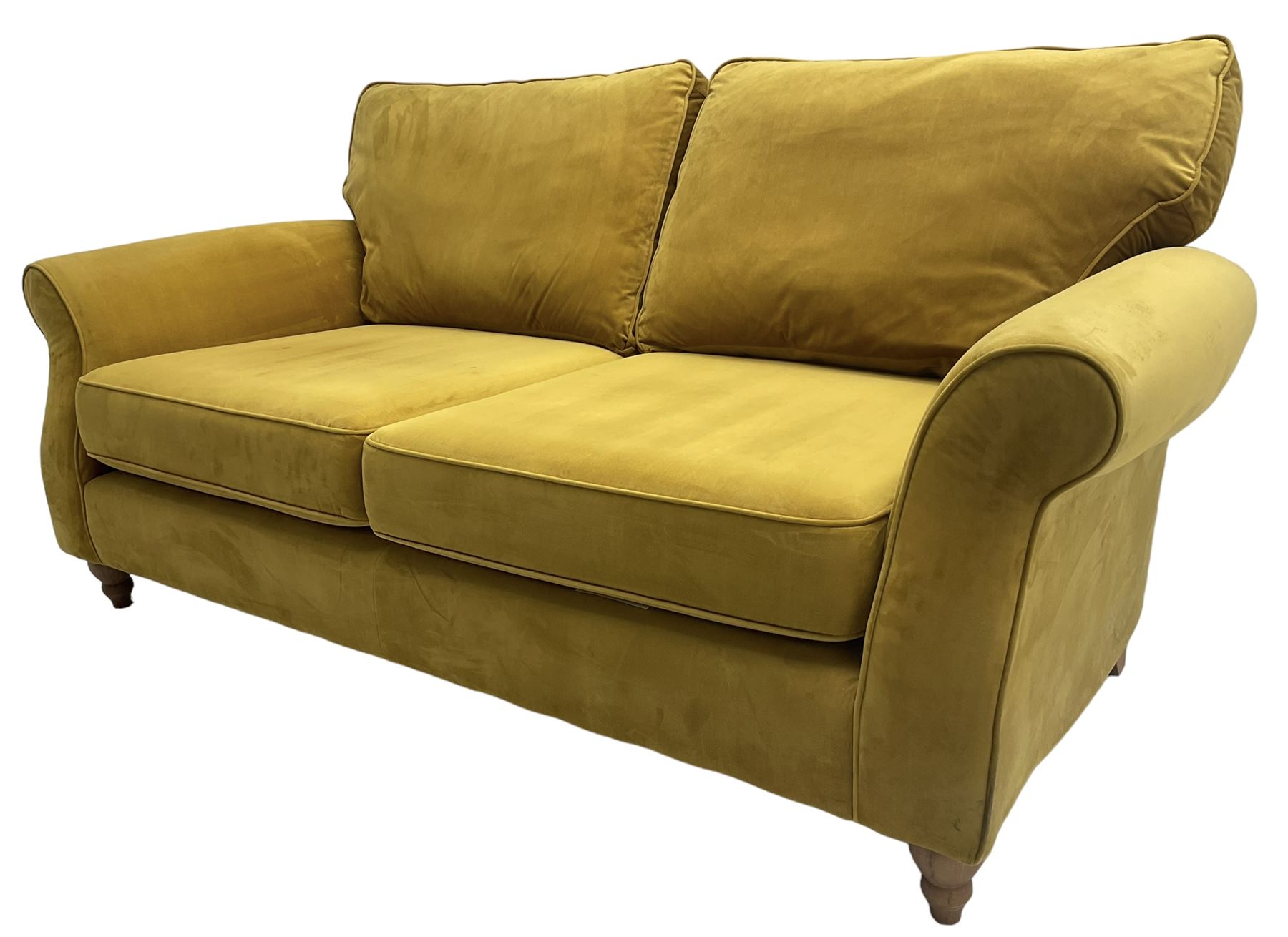 Next Furniture - traditional shaped three-seat sofa, upholstered in mustard velvet, rolled arms with pipping, on turned front feet