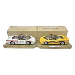  Two Maisto 1:12 scale Jaguar XJ220 scale cars comprising 1992 ‘Concept Car’ West Midlands Police car and 1994 ‘Jag 999’ Thames Valley Police Traffic Car, both on plinths with original boxes and certificates of authenticity 