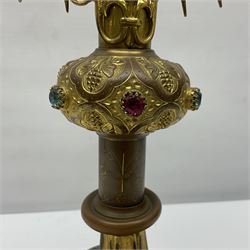 20th century gilt metal monstrance, in the Gothic revival style, with glazed aperture to centre surrounded with clear paste stones, in a pierced floral and scroll border set with coloured paste stones, within a sunburst surround, on a paste set knopped stem and similar foliate foot, H59.3cm