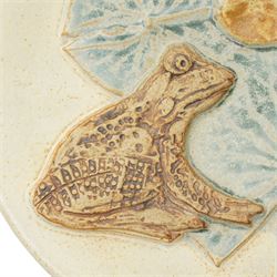 Bernard Rooke (1938-) - Studio pottery dish of shaped oval form with a raised pattern of lily pads and frogs W29cm with Bernard Rooke paper label and purchased from The Mill Gallery, Swilland, Ipswich and inscribed 'B R'