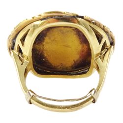 19th century gold portrait ring, set with a circular miniature of a young woman in 18th century dress on ivory, under a glazed panel, within a gold scroll frame and pierced gallery. This lot has been registered for sale under Section 10 of the APHA Ivory Act