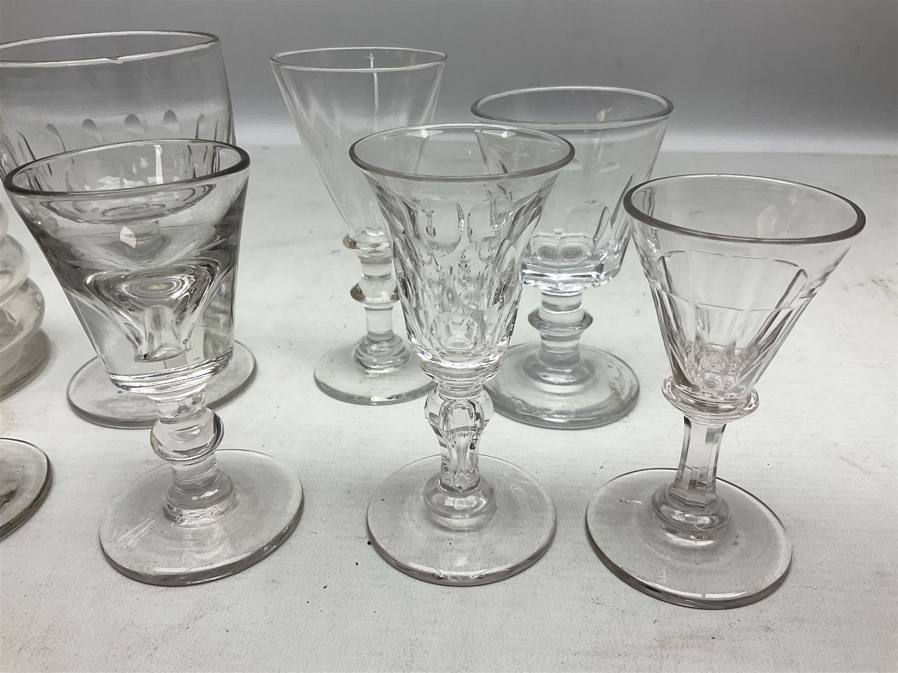 Quantity of Georgian and Victorian glasses, comprising late 19th century Beehive decanter, two thumb print rummer glasses, two 1780s Bristol glass of wrythen form, early Victorian toastmasters glass, two late Georgian wine glasses, late 18th century petal moulded wine glass, and early 19th century facet cut small wine glass