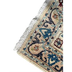 Persian Nain blue and ivory ground rug, wool with silk inlay, overall arabesque design, central medallion surrounded by interlacing and scrolled leafy branches and palmettes, the scrolling border decorated with stylised plant motifs, within guard stripes